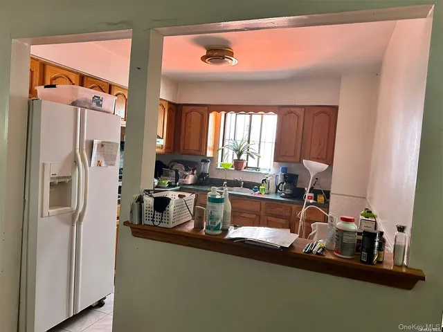 a kitchen with a sink appliances and cabinets