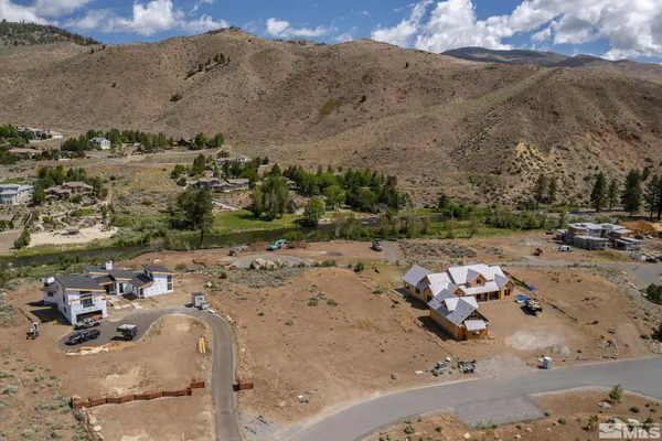an aerial view of a town with couple of houses