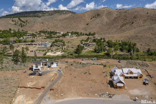 an aerial view of a yard with horses