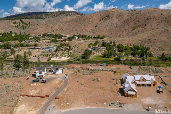 an aerial view of a yard with horses