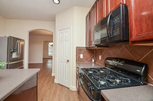 a kitchen with a stove and a microwave