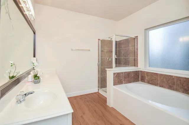 a bathroom with a bathtub and a sink