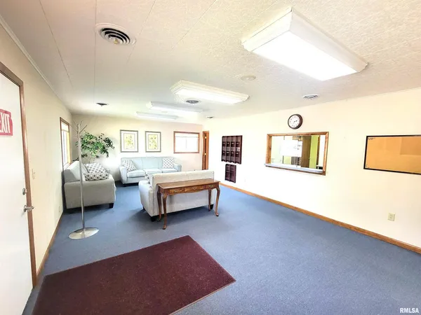 a view of a hallway view with living room