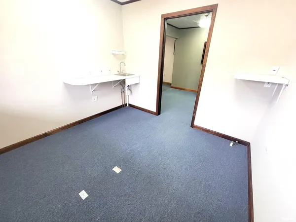 a living room with furniture and a gate