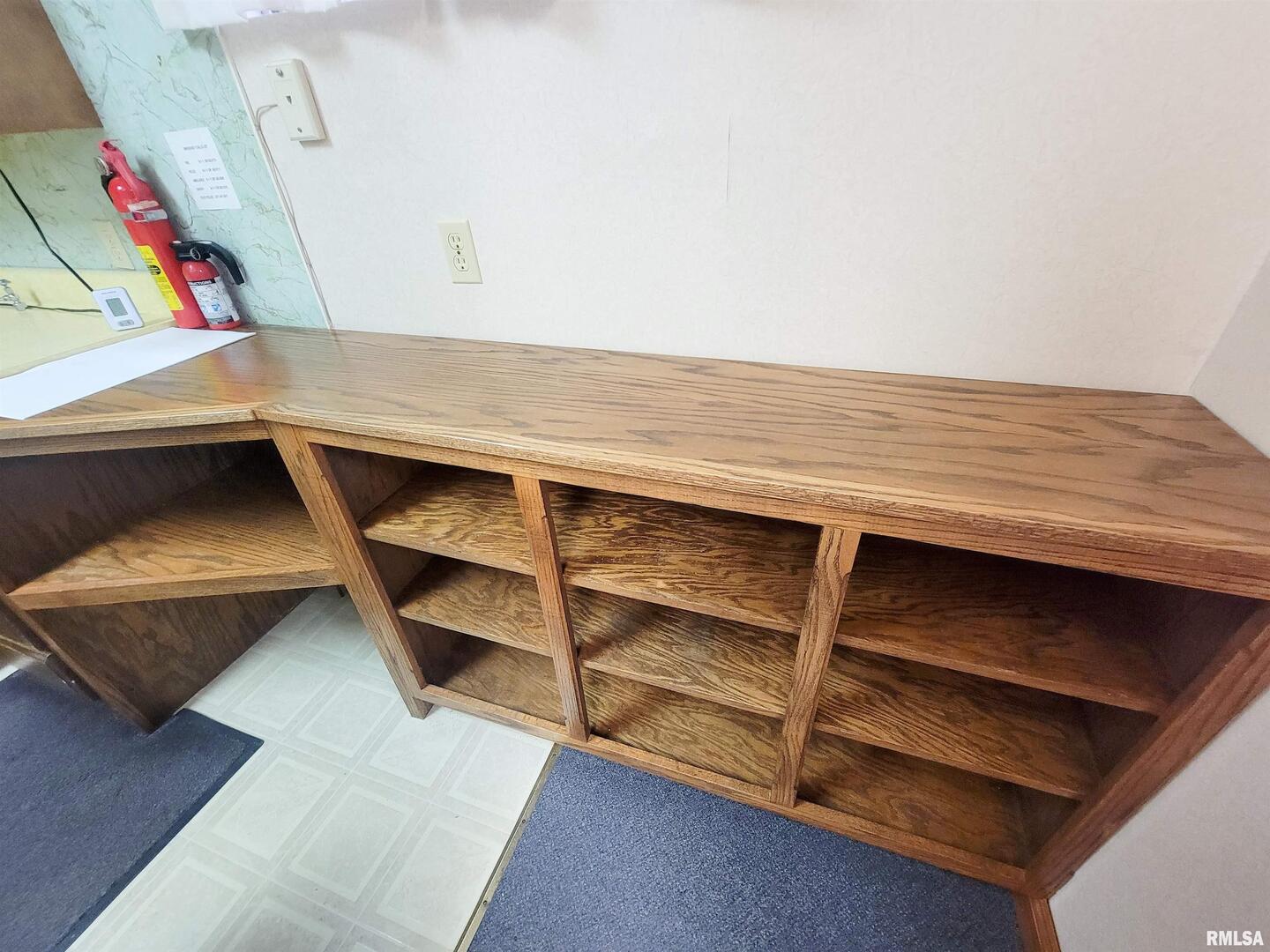 119 West 2nd Street Flora, IL 62839 - Photo 69 of 99 a view of an empty room with wooden floor and cabinet