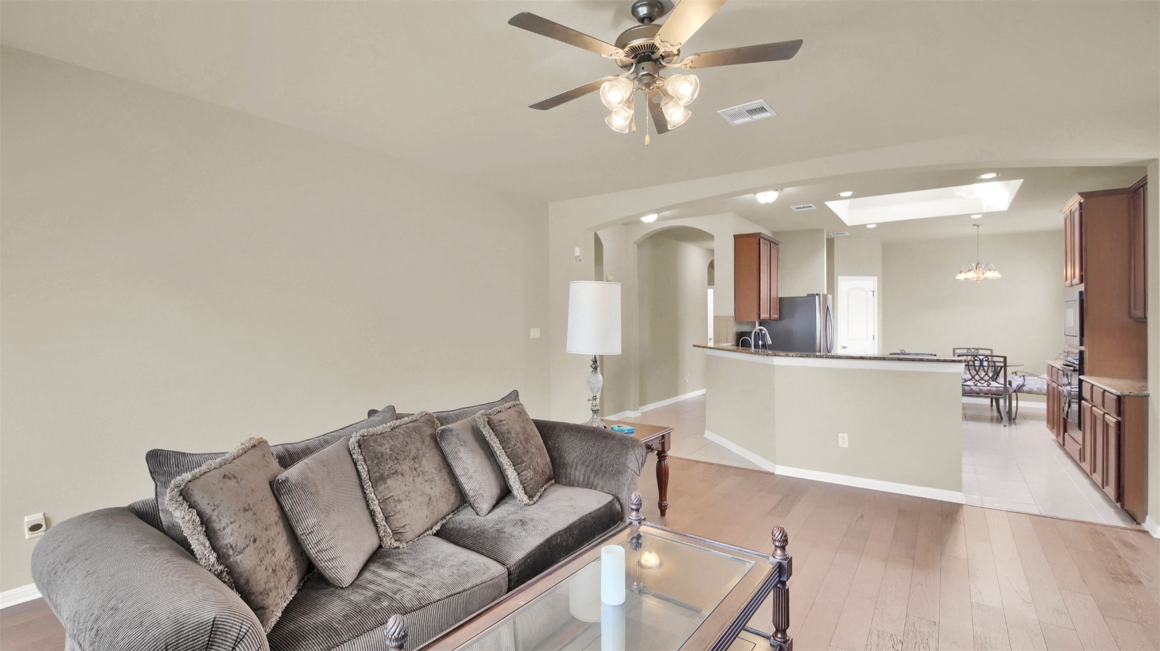 2979 Freemont Street Round Rock, TX 78681 - Photo 23 of 40 Living area featuring light wood-style floors, ceiling fan, and suspended lighting