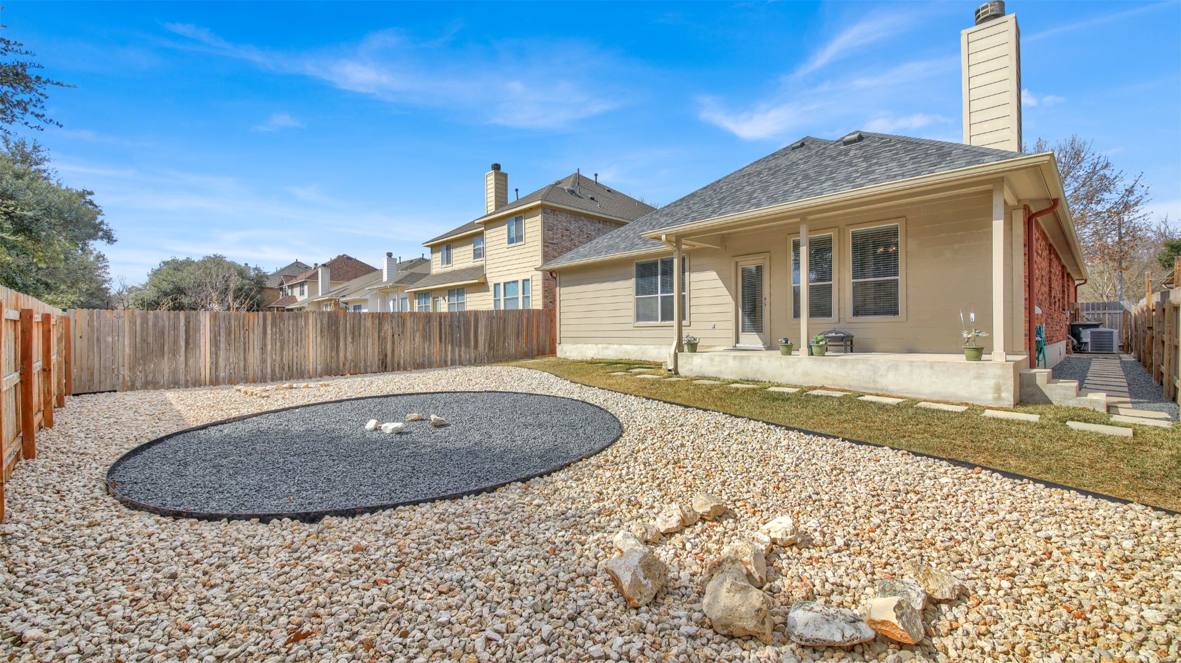 2979 Freemont Street Round Rock, TX 78681 - Photo 35 of 40 Back of house with a patio area, a fenced backyard, and a chimney