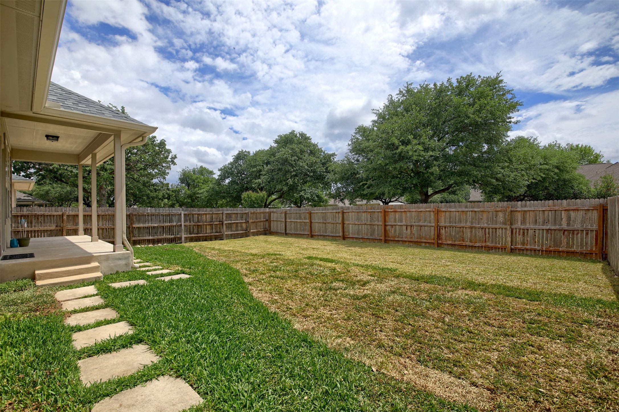 2979 Freemont Street Round Rock, TX 78681 - Photo 36 of 40 The property features a generously sized yard with a wooden privacy fence and mature trees along the perimeter