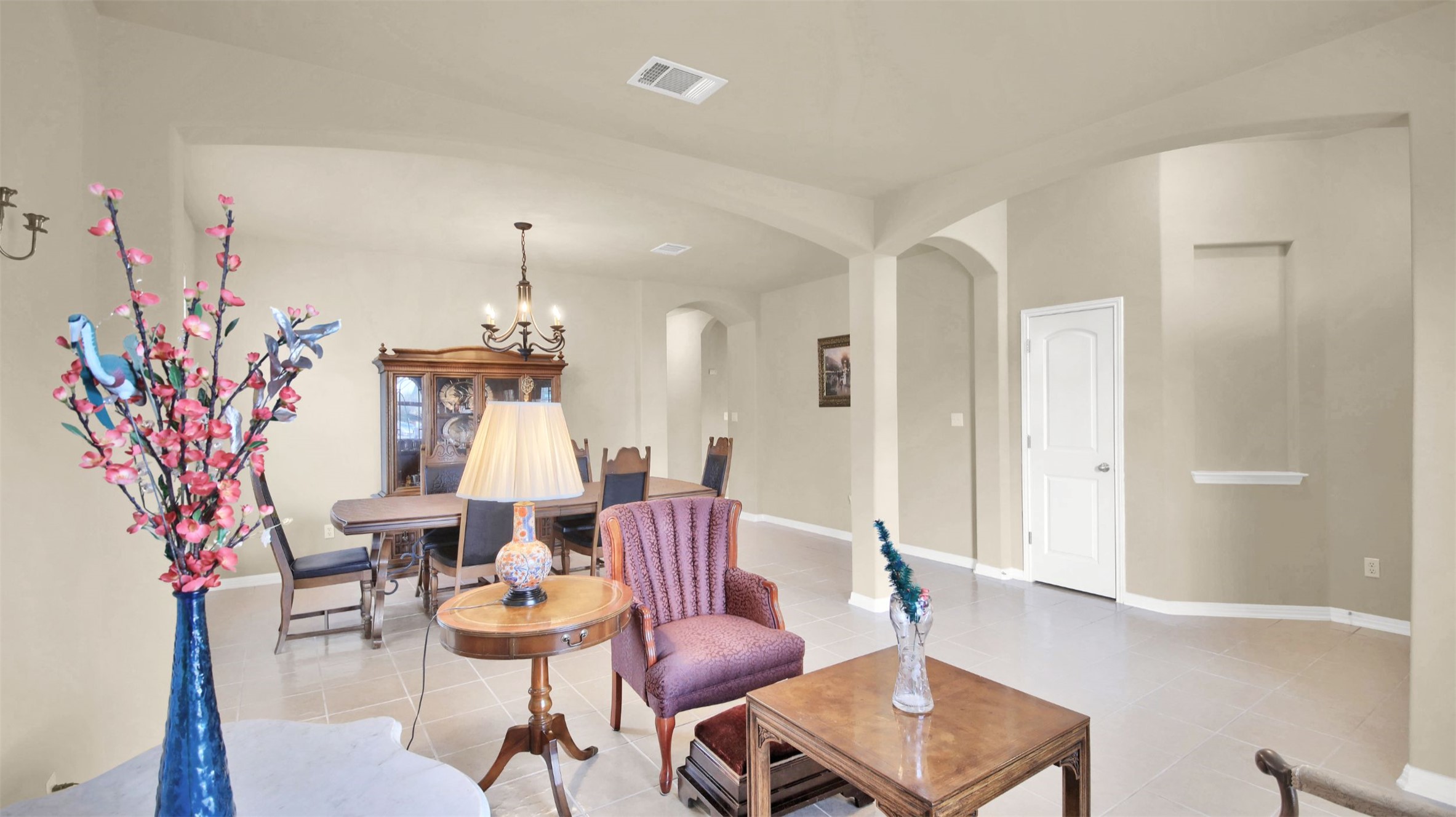 2979 Freemont Street Round Rock, TX 78681 - Photo 8 of 40 Sitting room with hanging lights and arched walkways