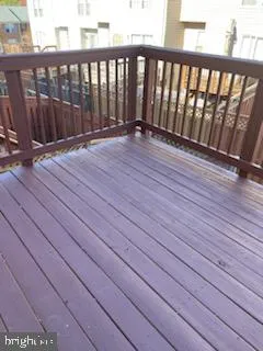 a view of balcony with wooden floor