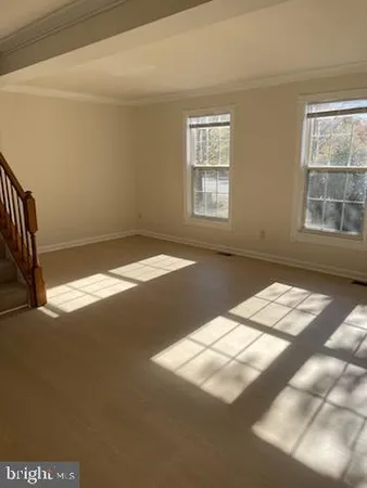 a view of empty room with windows