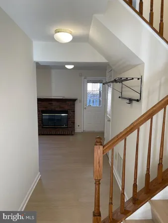 a view of an entryway with wooden floor