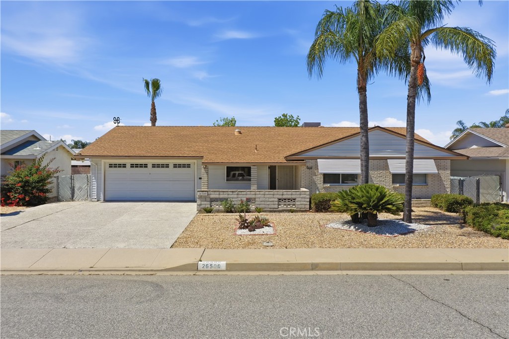 26500 New Bedford Road Menifee, CA 92586 - Photo 1 of 47 a front view of a house with a garden
