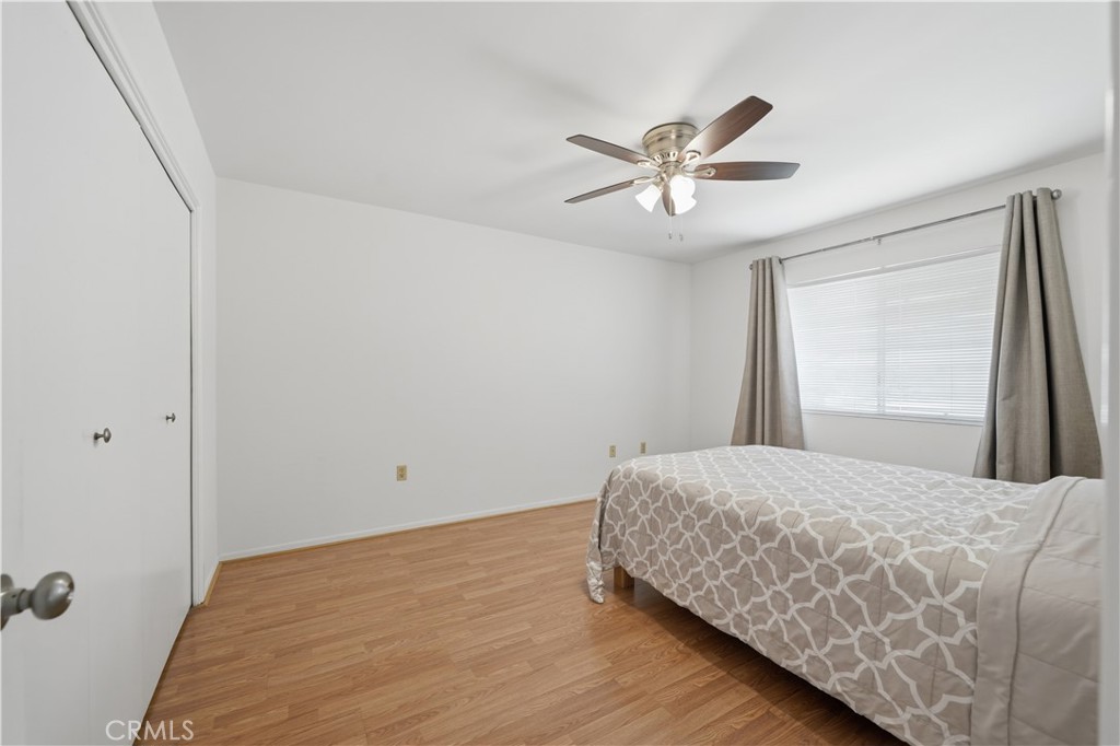 26500 New Bedford Road Menifee, CA 92586 - Photo 27 of 47 a bedroom with a bed and a window