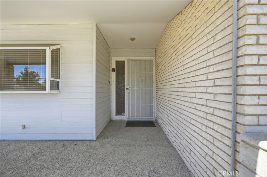 26500 New Bedford Road Menifee, CA 92586 - Photo 4 of 47 a view of a brick house with an empty space