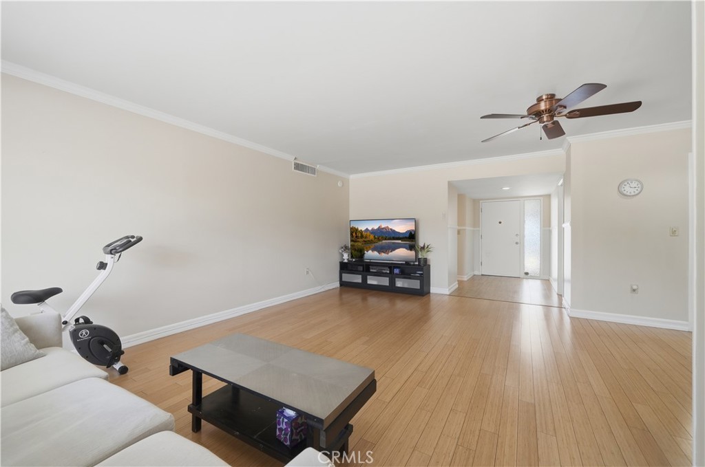 26500 New Bedford Road Menifee, CA 92586 - Photo 6 of 47 a living room with furniture and a wooden floor