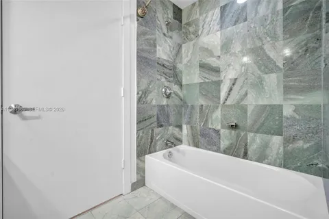 a view of a storage & utility room with washer and dryer