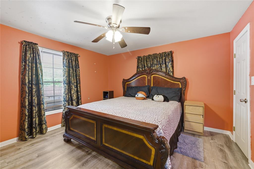3624 Redbird Street Bellmead, TX 76705 - Photo 13 of 20 a bed sitting in a room next to a window