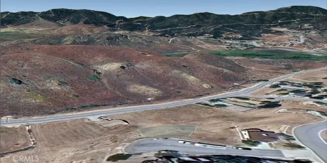a view of a dry yard with mountain