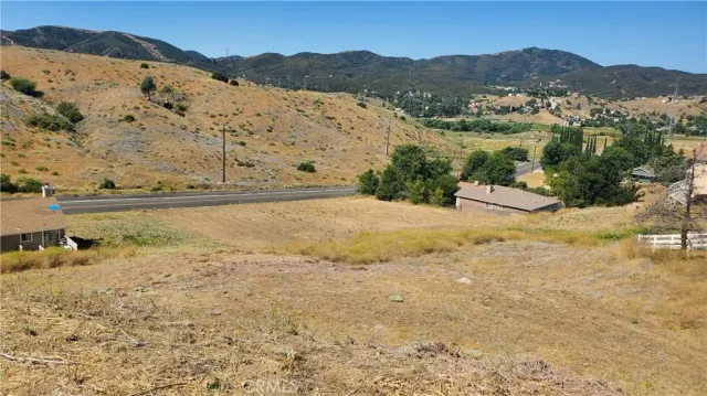 a view of ocean with mountain