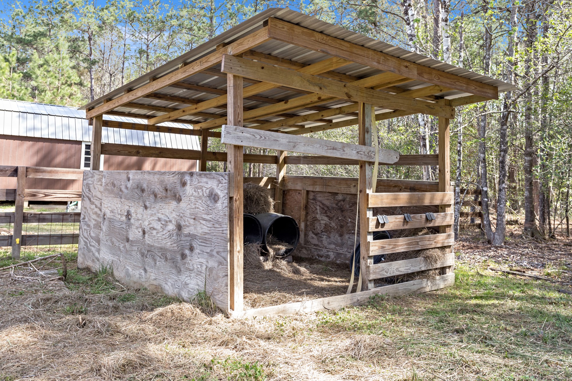 4943 Fm 770 Road Kountze, TX 77625 - Photo 15 of 15 a view of a wooden house with a large tree