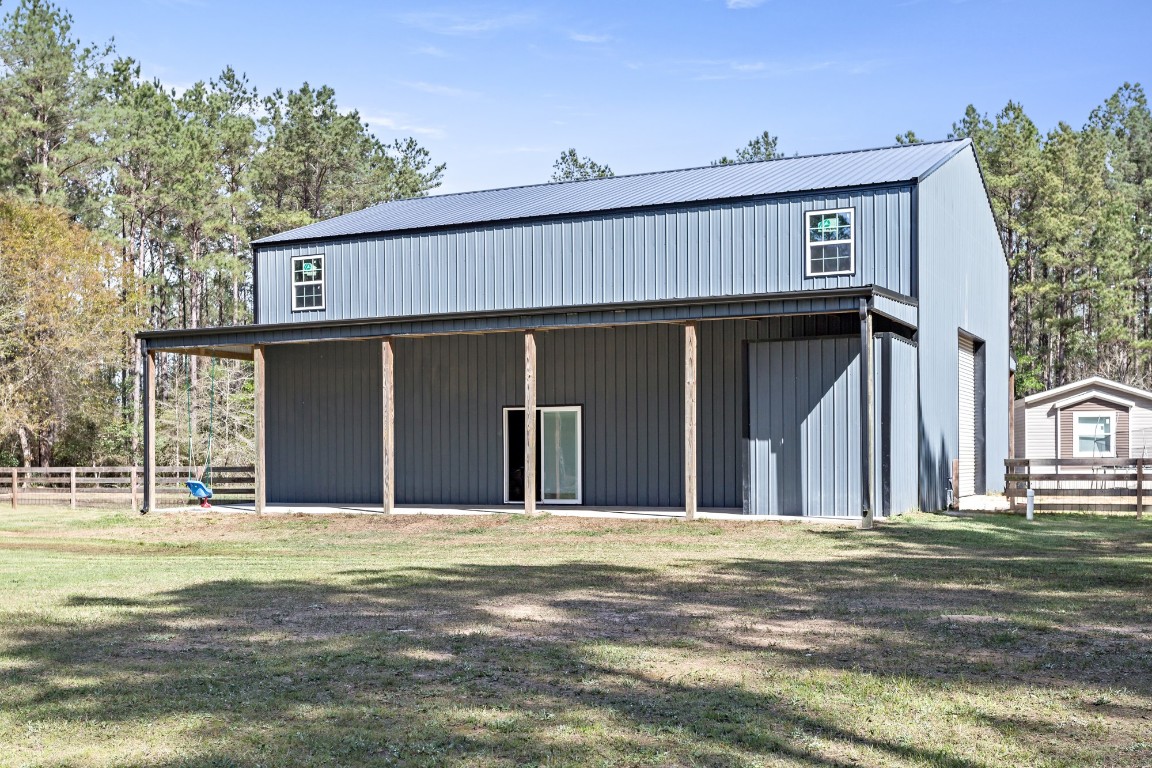 4943 Fm 770 Road Kountze, TX 77625 - Photo 10 of 15 a view of a house with a outdoor space