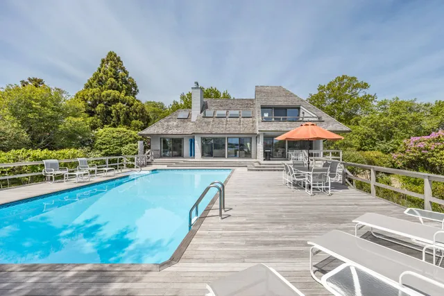 swimming pool view with a outdoor seating