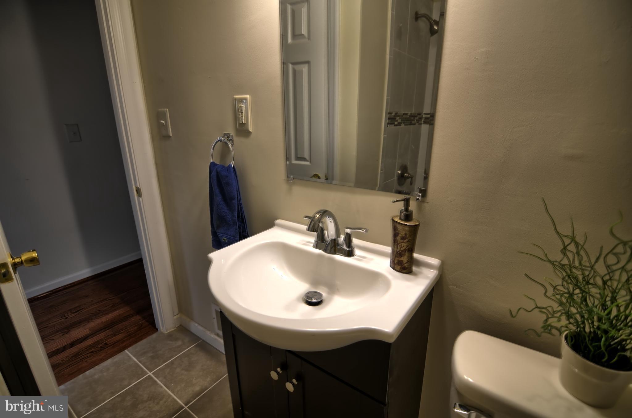 2603 Randolph Road Silver Spring, MD 20902 - Photo 1 of 26 a bathroom with a sink and a mirror