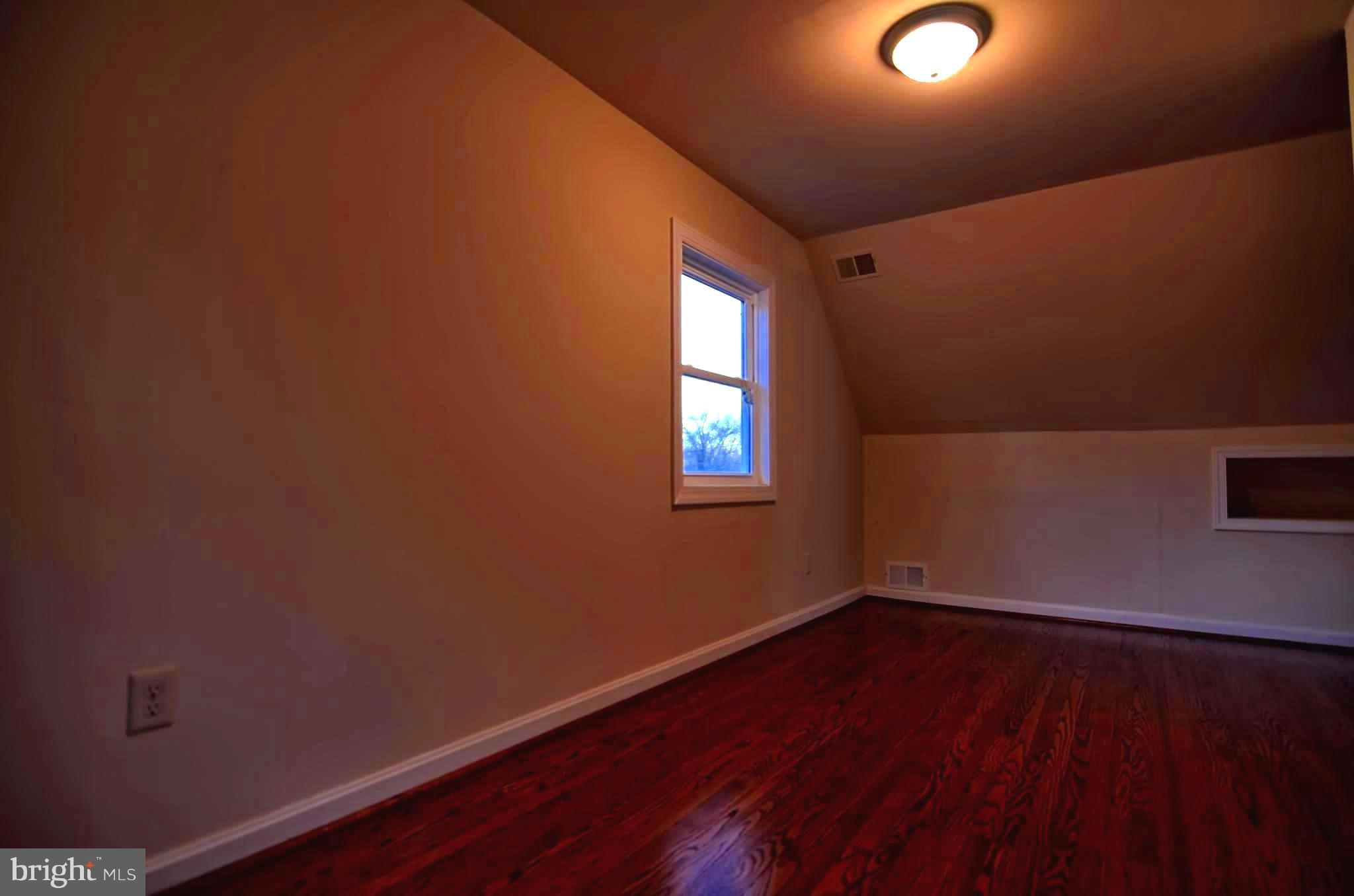 2603 Randolph Road Silver Spring, MD 20902 - Photo 2 of 26 a view of empty room with wooden floor and fan