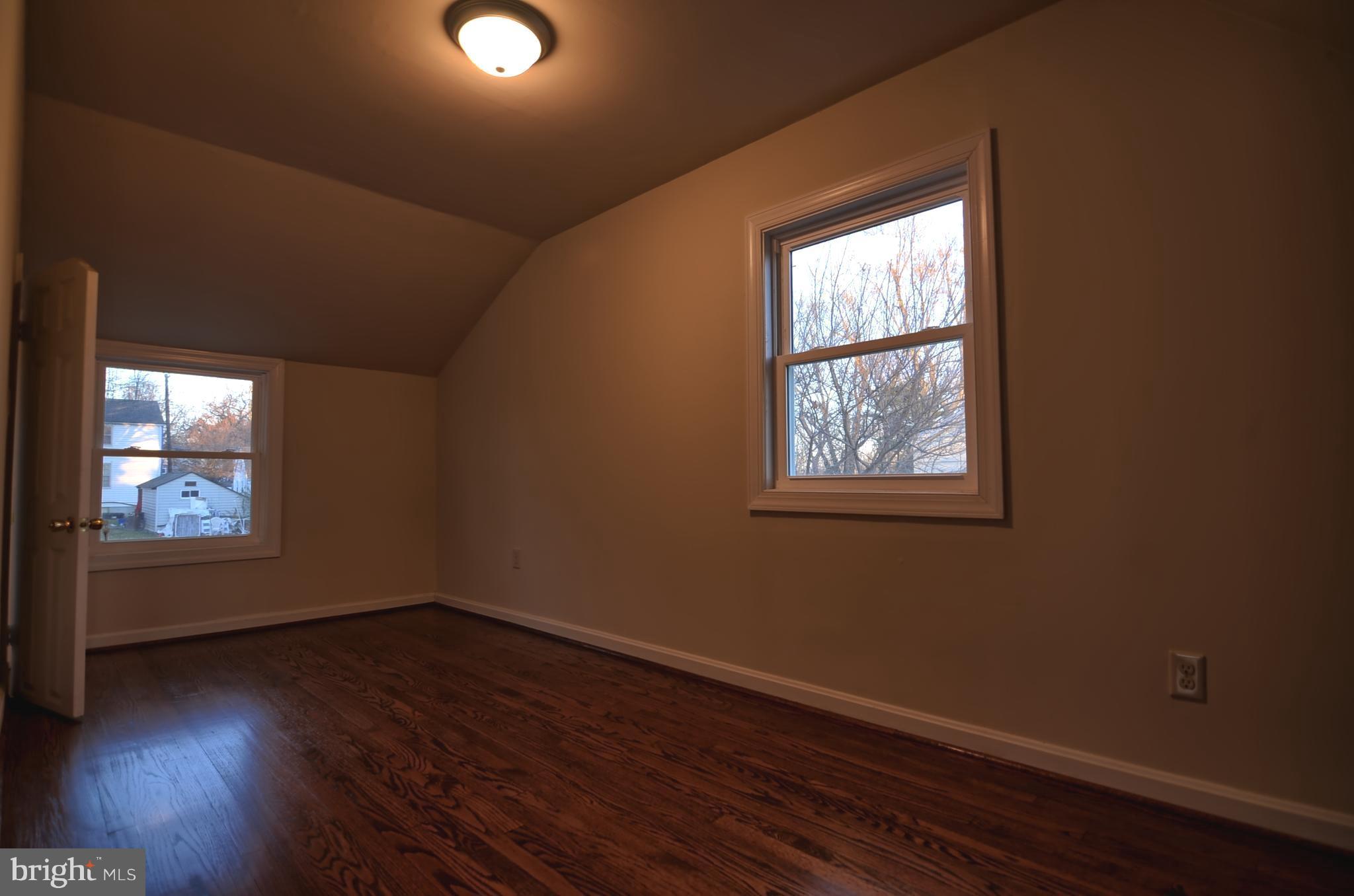 2603 Randolph Road Silver Spring, MD 20902 - Photo 11 of 26 an empty room with wooden floor and windows