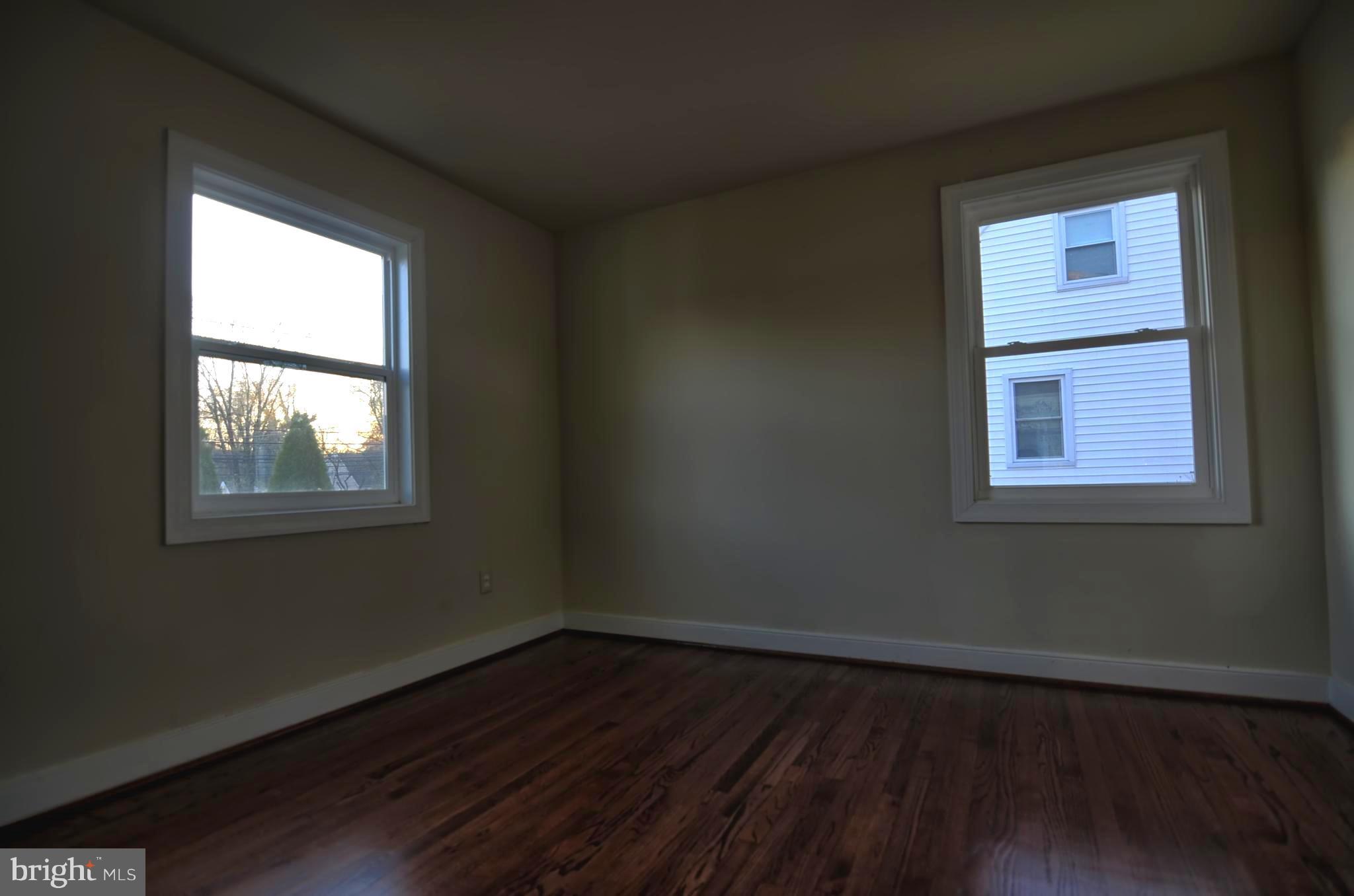 2603 Randolph Road Silver Spring, MD 20902 - Photo 3 of 26 an empty room with wooden floor and windows