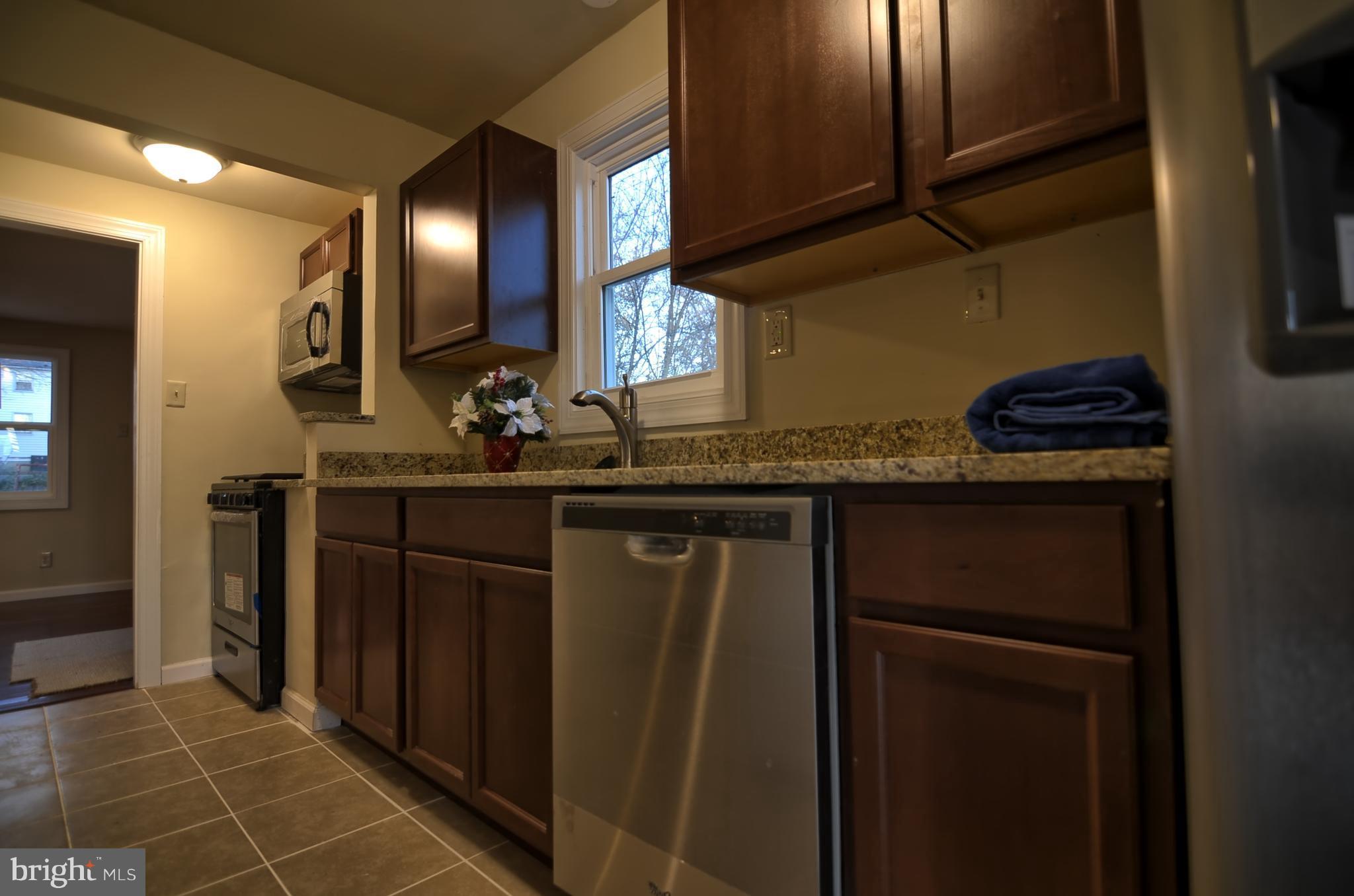 2603 Randolph Road Silver Spring, MD 20902 - Photo 25 of 26 a kitchen with a sink and cabinets