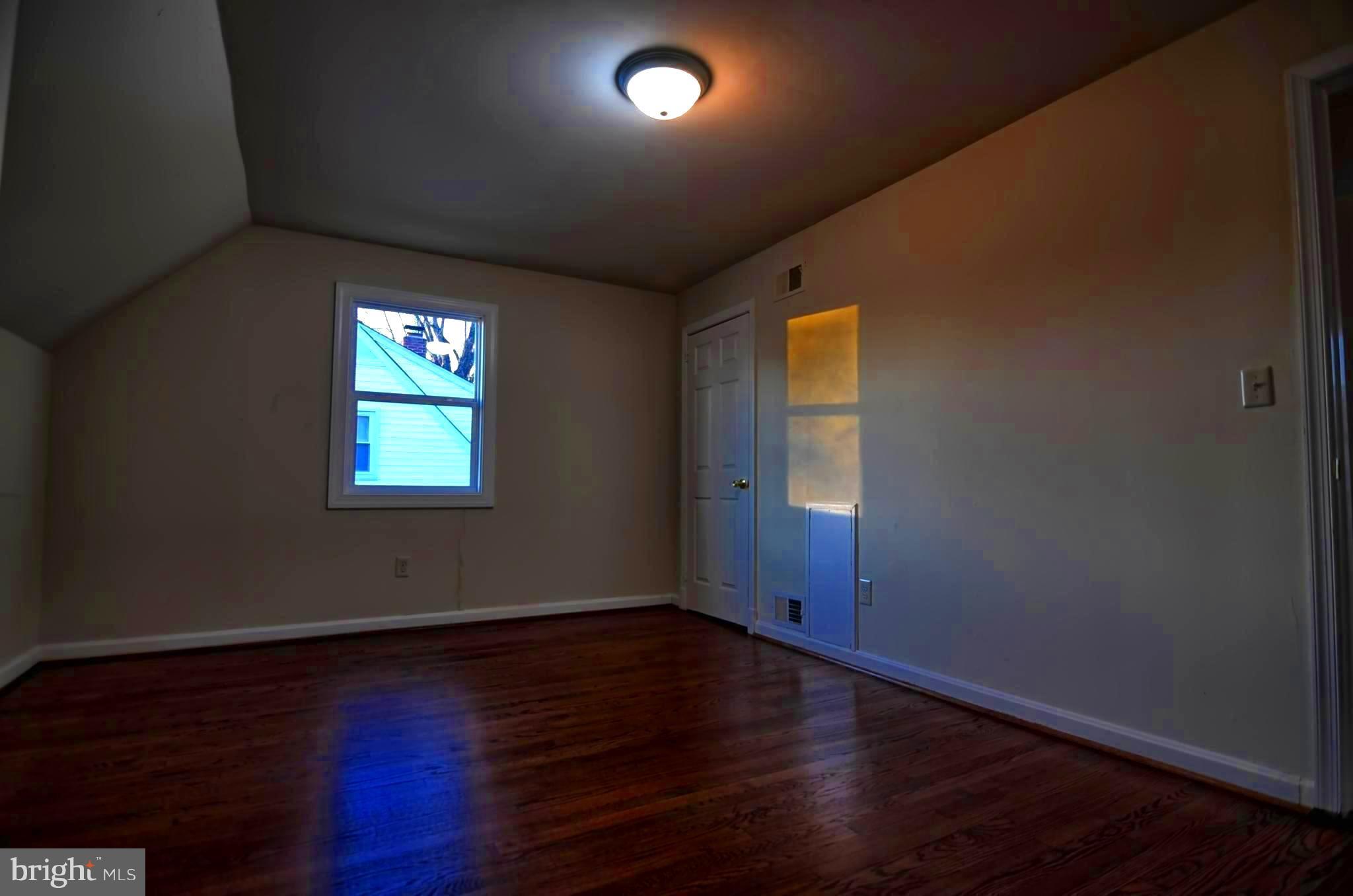 2603 Randolph Road Silver Spring, MD 20902 - Photo 4 of 26 an empty room with wooden floor and windows