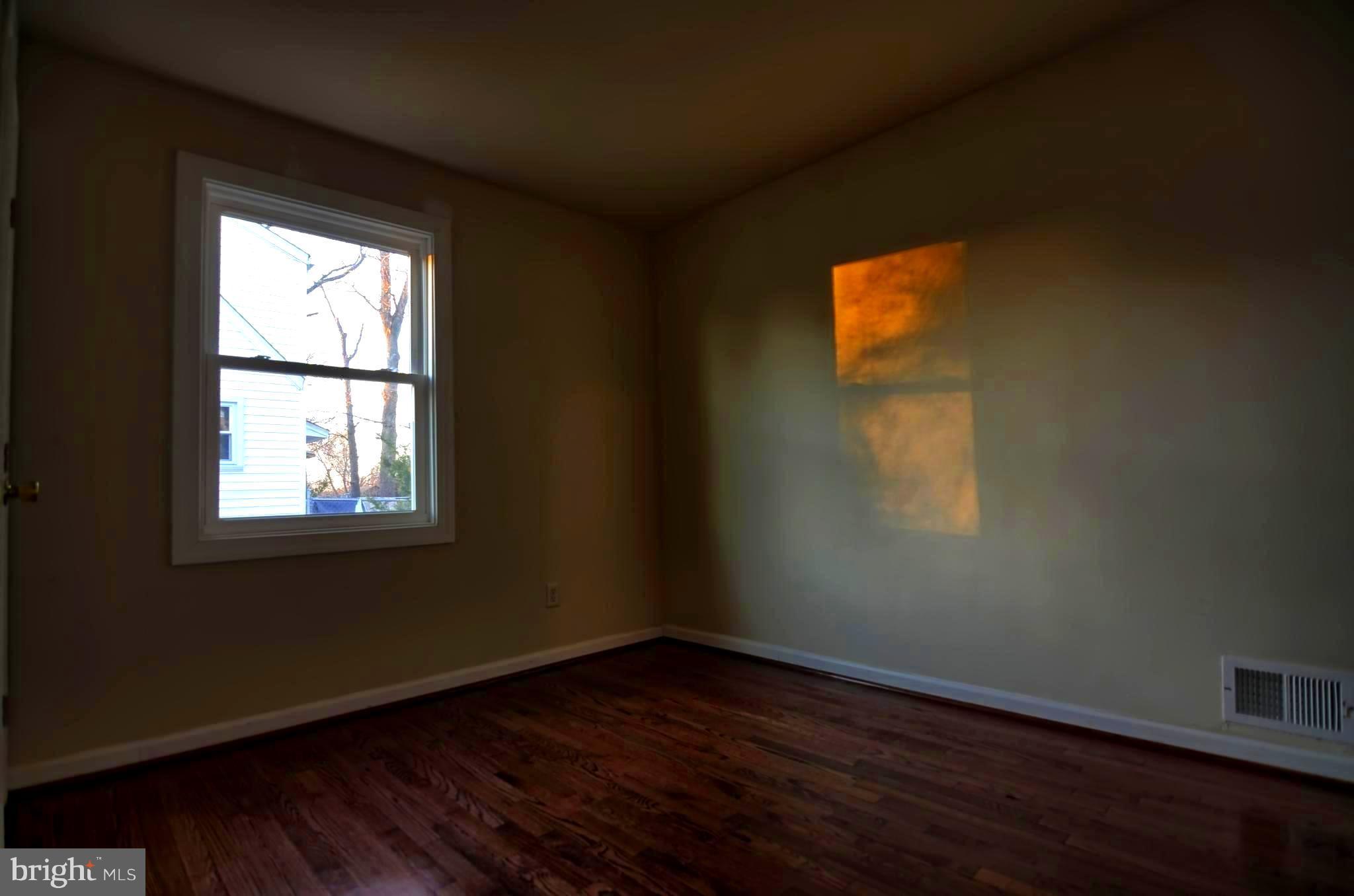 2603 Randolph Road Silver Spring, MD 20902 - Photo 9 of 26 a view of an empty room with wooden floor and a window