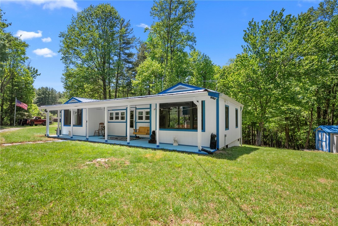 154 Folger Road Sparta, NC 28675 - Photo 1 of 37 a view of a house with a yard porch and sitting area