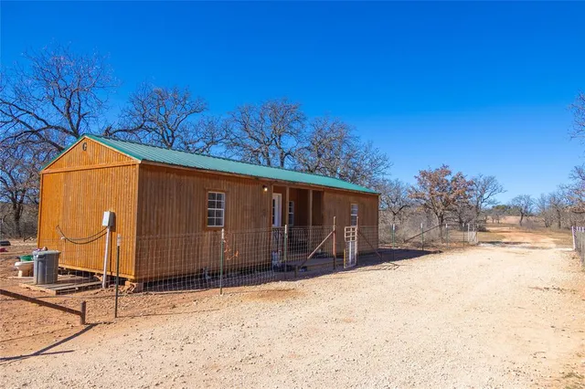 a view of a backyard of the house