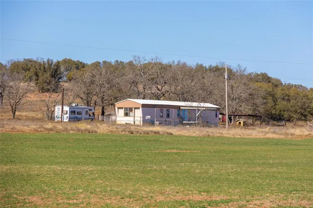 a view of a house with a big yard