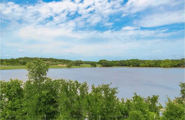 a view of a lake from a yard