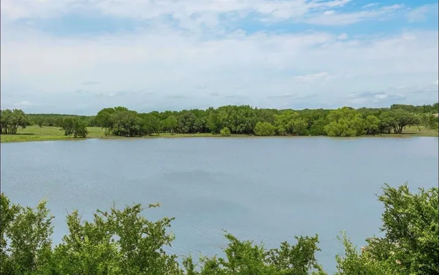 a view of a lake with a city