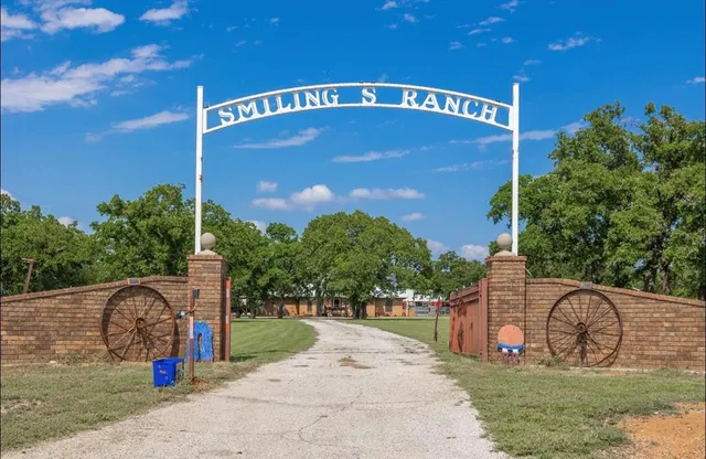 a view of a street with a building in the background