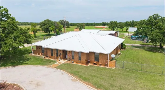 an aerial view of a house having swimming pool garden and patio