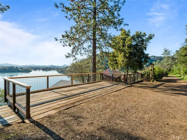 a view of a street with wooden fence