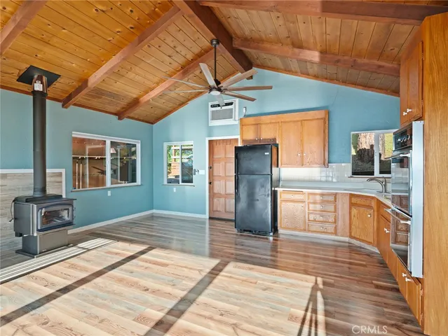 a view of a kitchen with a sink and cabinets