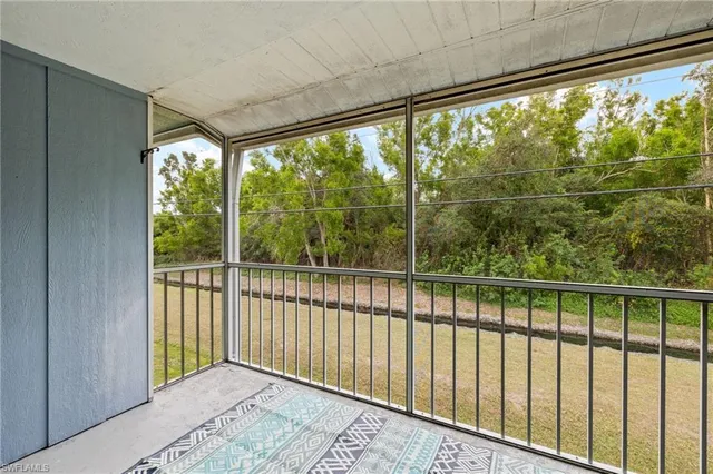 a view of a room with a large window