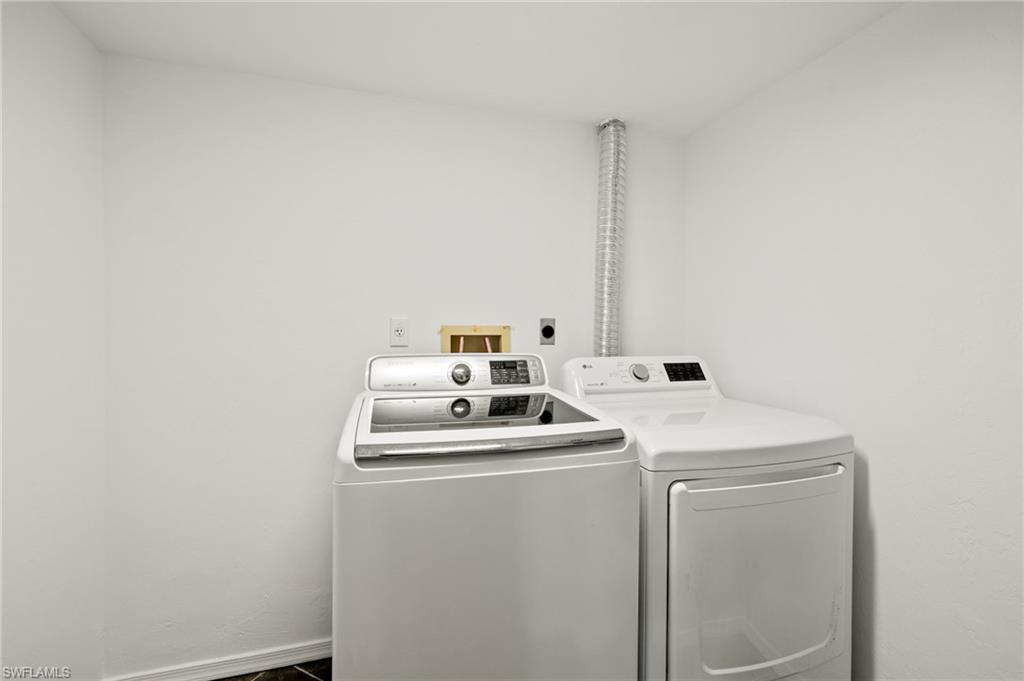 136 Cypress Way East, Unit 507 Naples, FL 34110 - Photo 20 of 21 a utility room with dryer and washer