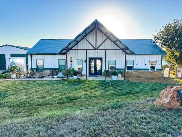 a kitchen with stainless steel appliances kitchen island granite countertop a refrigerator and microwave