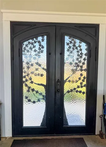 a en suite bathroom with a sink double vanity and a mirror
