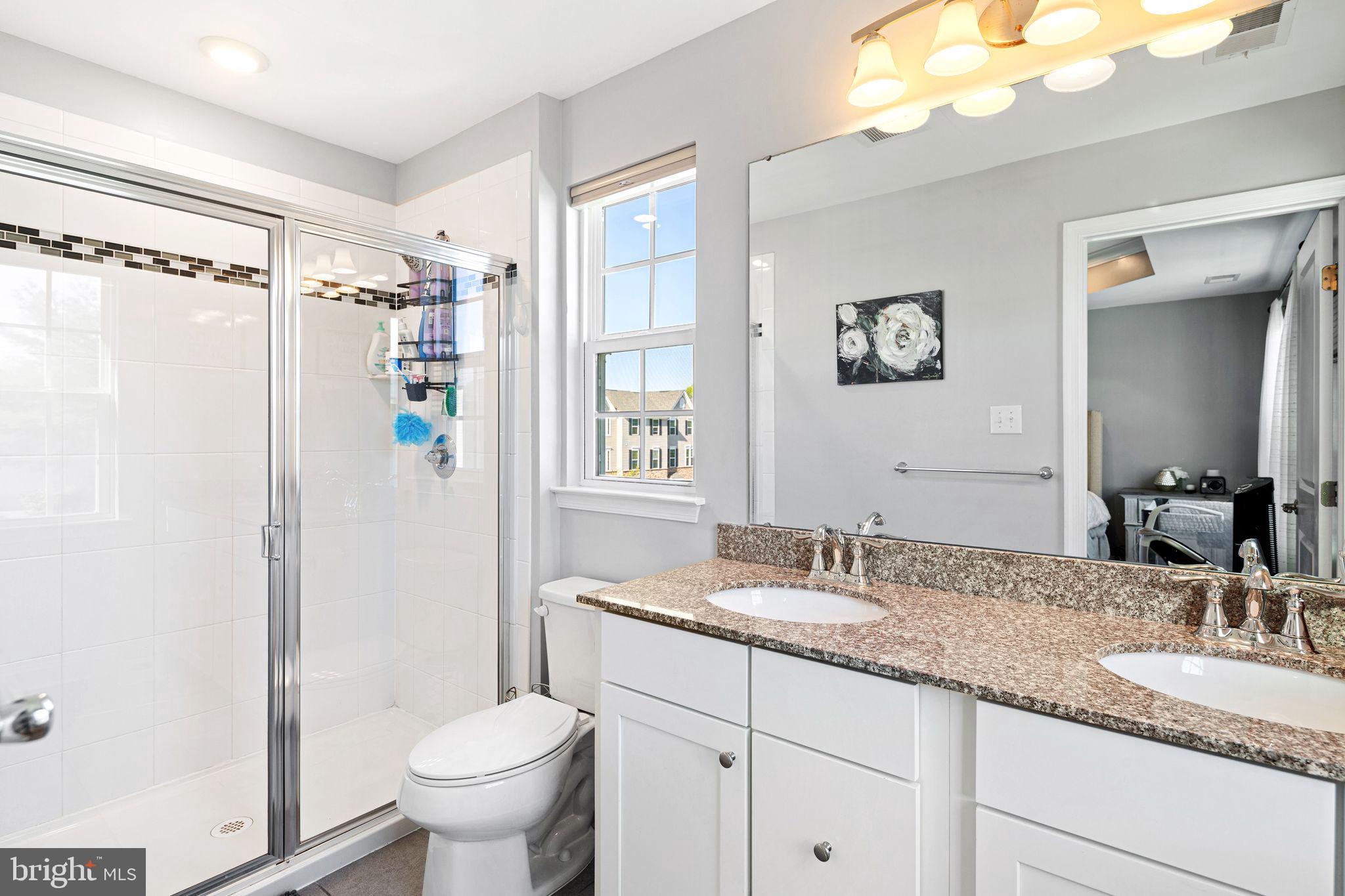 145 Meridian Lane Sewell, NJ 08080 - Photo 13 of 15 a bathroom with a granite countertop sink toilet and shower