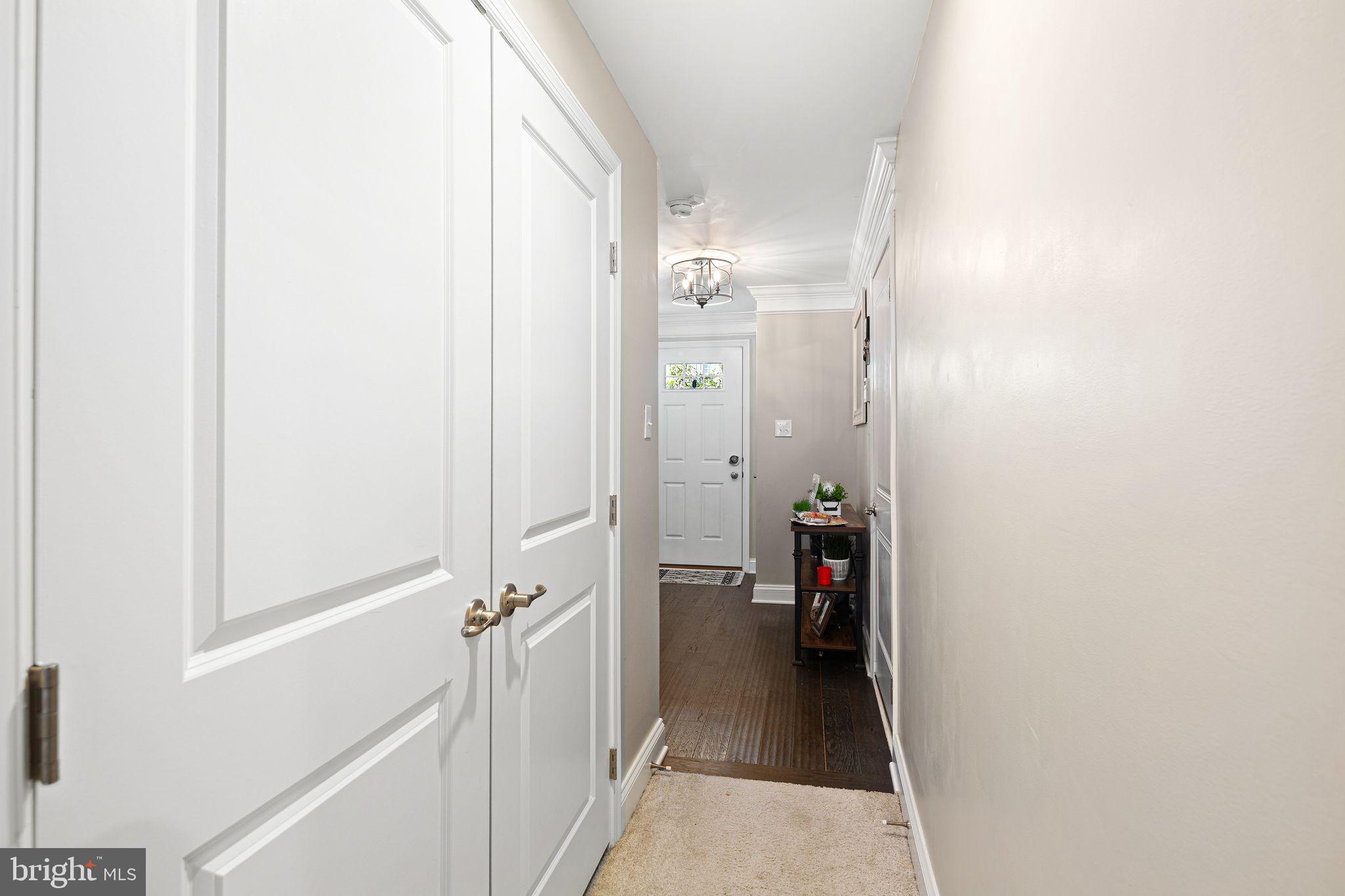 145 Meridian Lane Sewell, NJ 08080 - Photo 7 of 15 a view of a hallway with wooden floor and staircase