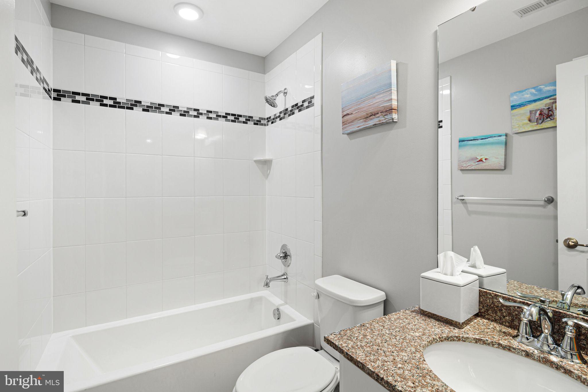 145 Meridian Lane Sewell, NJ 08080 - Photo 8 of 15 a bathroom with a granite countertop toilet sink and shower